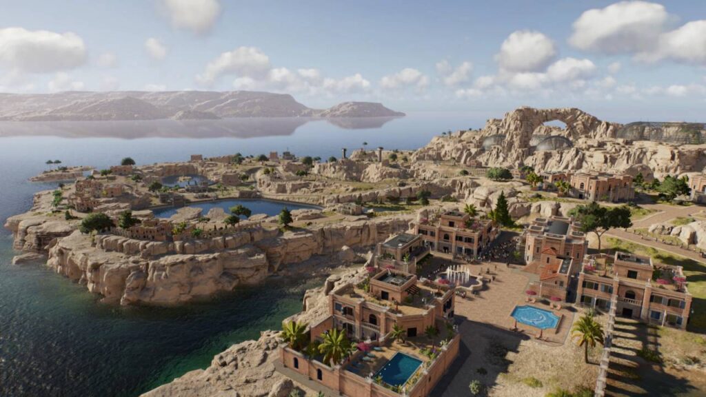 Jurassic World Evolution 3 Screenshot: mediterrane Küstenkarte mit Felsplateaus, Pools und Besucherplaza; Felsbogen und Gehegekuppeln im Hintergrund.