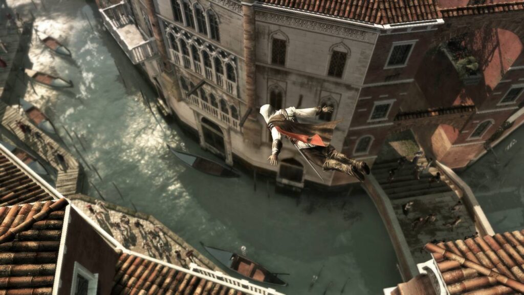 Ein Assassine springt von einem Dach in einen venezianischen Kanal. Szene aus Assassin’s Creed 2, einem der legendärsten Spiele von Ubisoft.