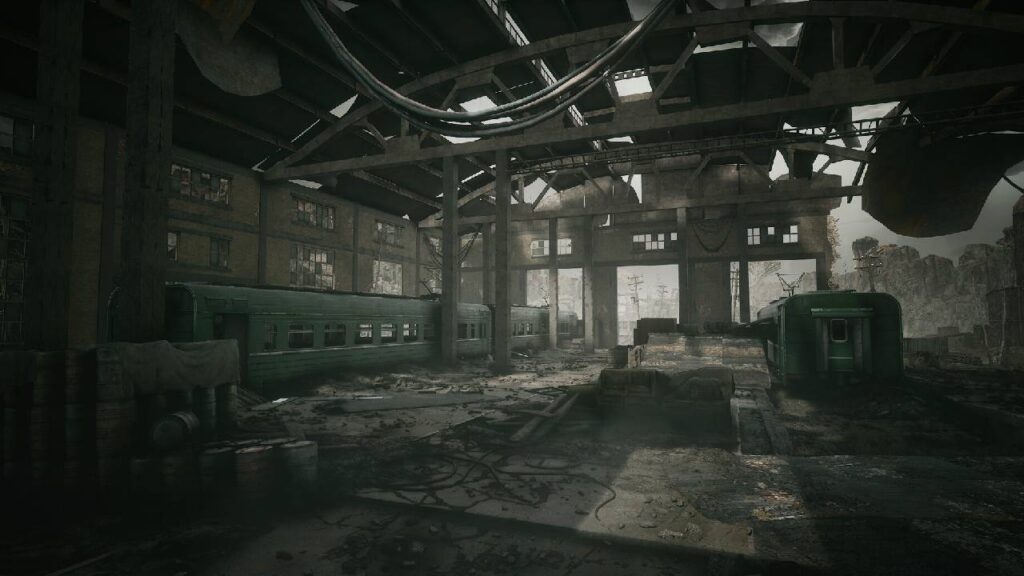 PIONER Screenshot mit verlassener Sowjet-Halle und alten Zugwaggons in einer postapokalyptischen Umgebung.