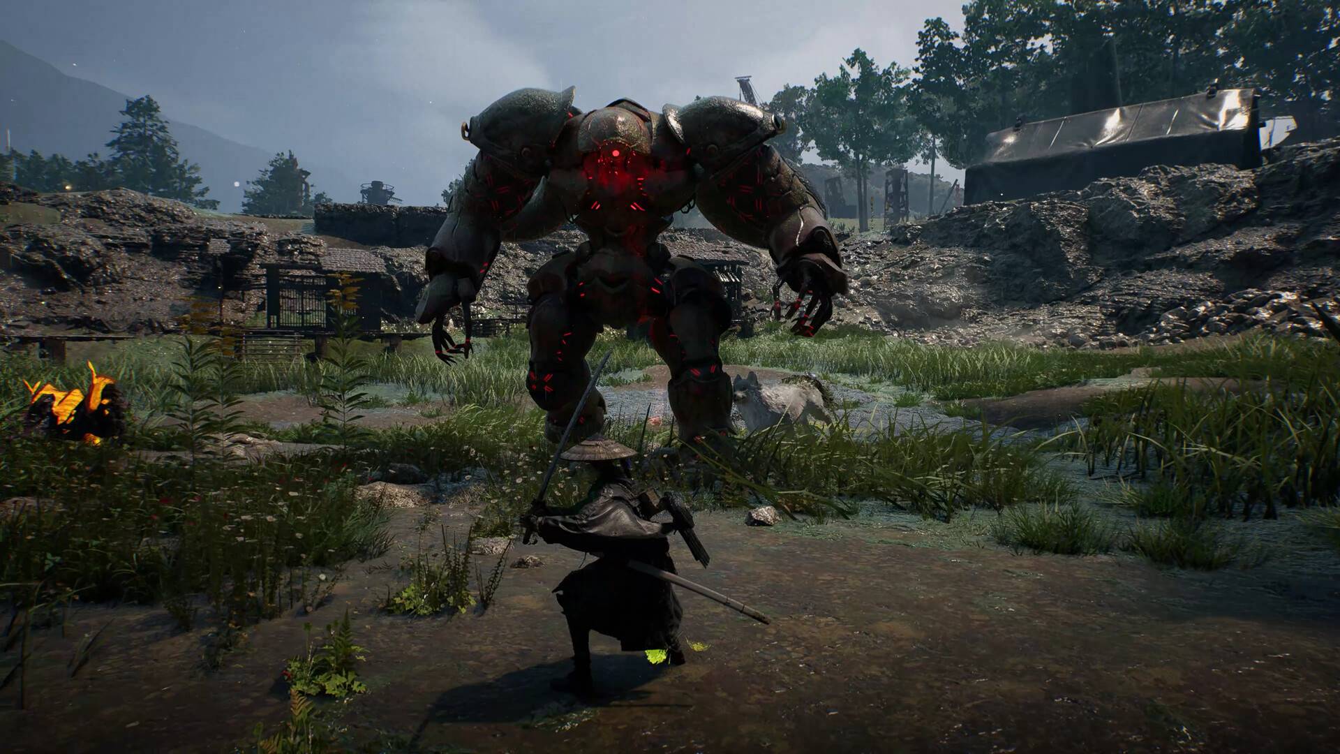 Kampf gegen einen massiven, von roter Energie durchzogenen Golem in einer verwüsteten Landschaft aus Beast of Reincarnation.