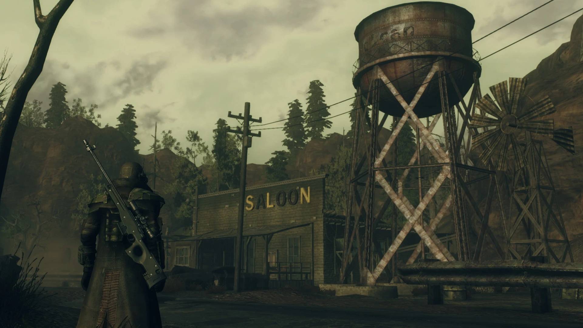 Fallout: Forgotten Valley zeigt eine düstere Siedlung mit Saloon, Wasserturm und bewaffneter Figur in verlassener Ödland-Atmosphäre.