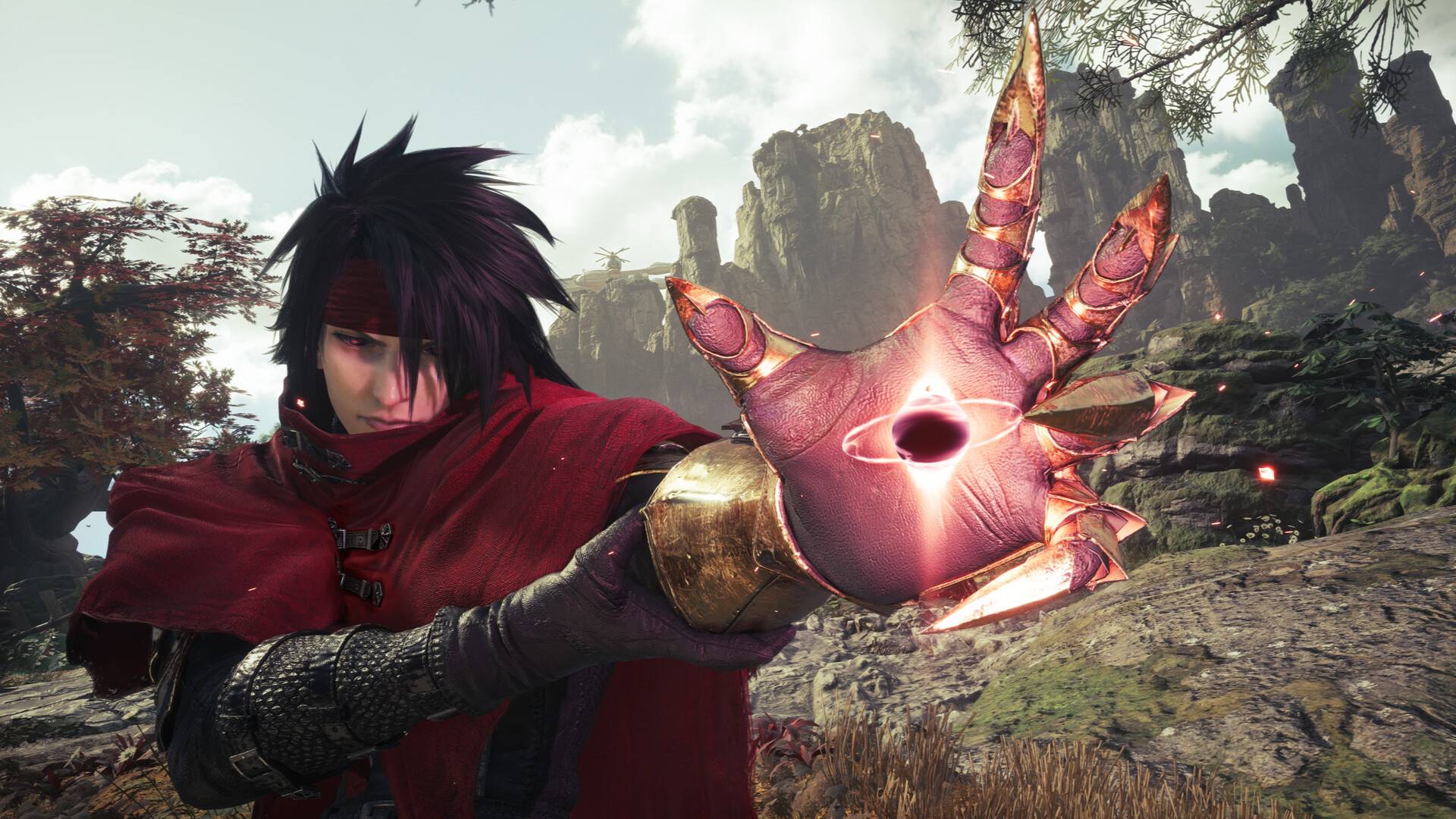 Vincent Valentine aus Final Fantasy 7 Revelation hält eine leuchtende, krallenartige Hand vor eine felsige Landschaft