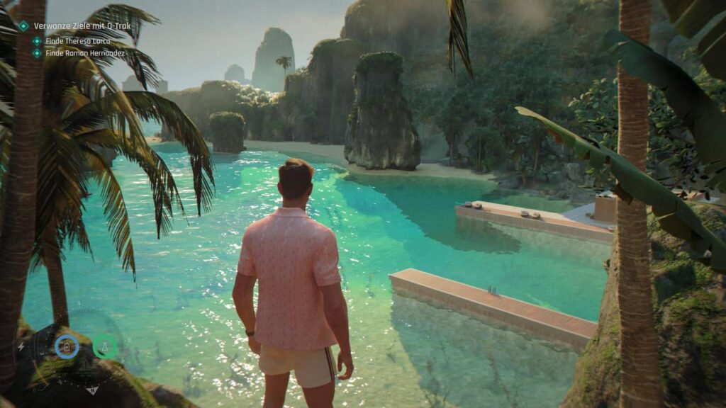 James Bond blickt in 007 First Light auf eine tropische Bucht mit türkisfarbenem Wasser