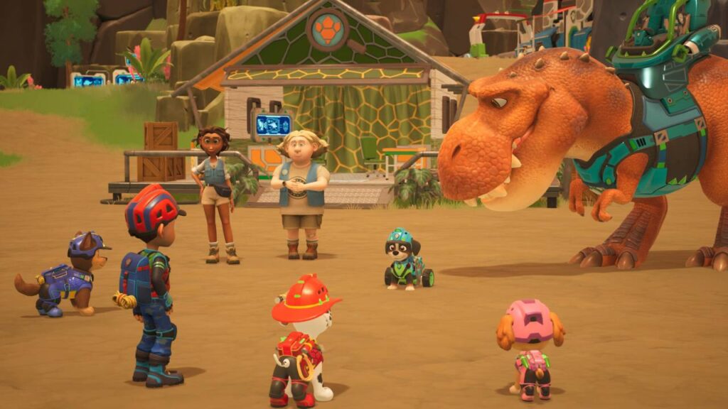 Die PAW-Patrol-Welpen stehen mit Ryder vor einem großen Dinosaurier auf der Dino-Insel.