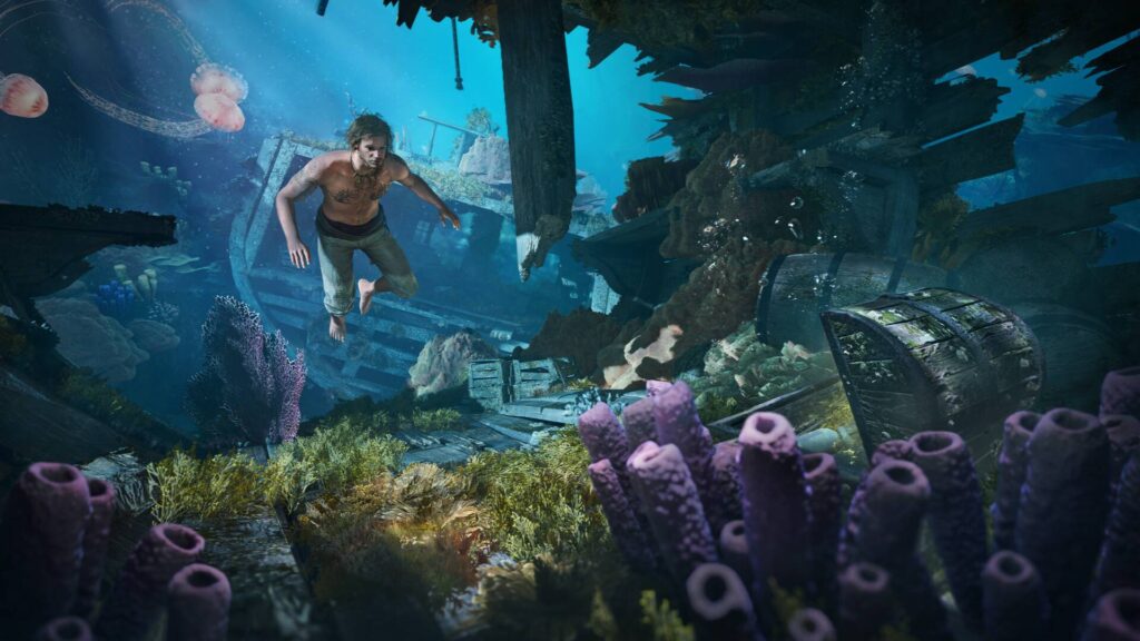 Assassin’s Creed Black Flag Resynced zeigt einen tauchenden Piraten in einem versunkenen Schiffswrack mit Korallen, Quallen und Schatztruhe.