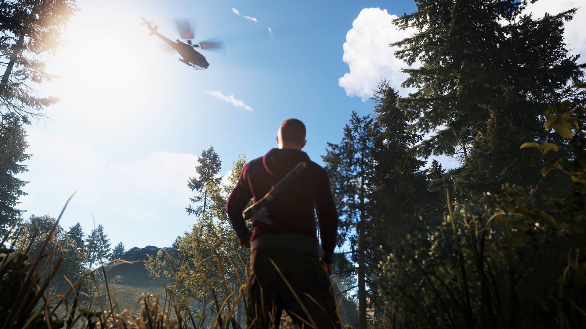 Rust zeigt einen Überlebenden im Wald, der bei hellem Sonnenlicht zu einem fliegenden Hubschrauber am Himmel blickt.