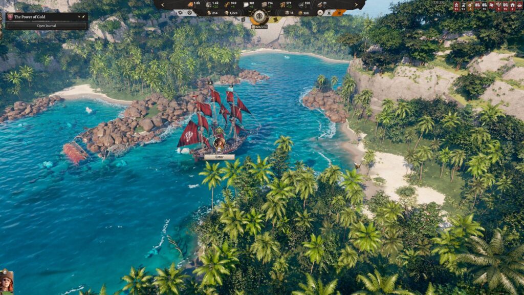 Ein Piratenschiff mit roten Segeln fährt in Corsair Cove durch eine tropische Bucht mit Palmen, Felsen und türkisblauem Wasser.