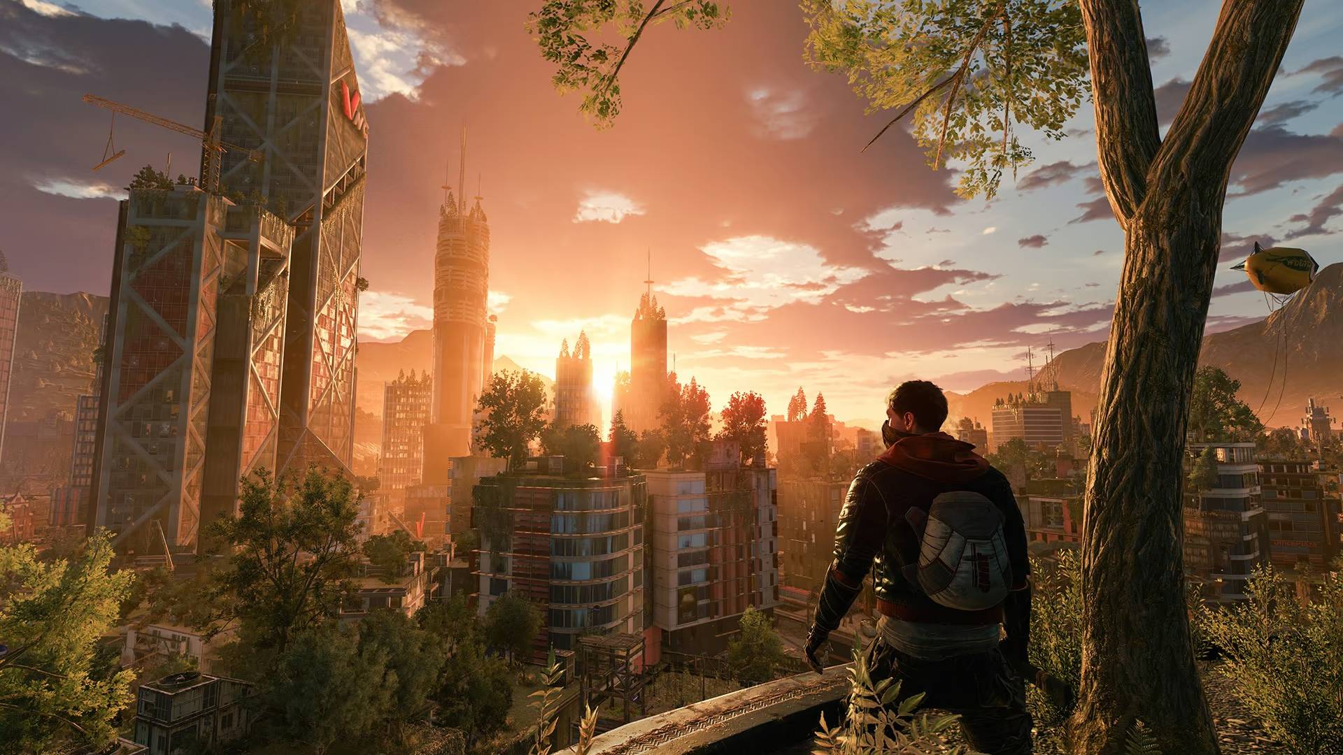 Aiden blickt in Dying Light 2 in der Third-Person-Ansicht bei Sonnenuntergang über die Stadt Villedor.