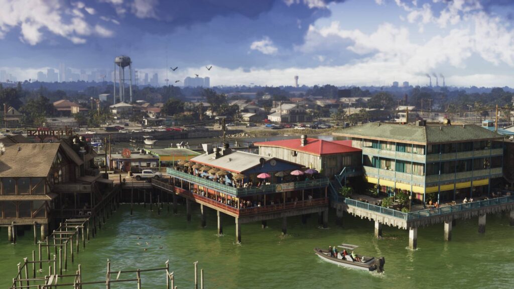 Küstenviertel in GTA 6 mit Restaurants und Gebäuden auf Stelzen, während ein Motorboot über das Wasser fährt.
