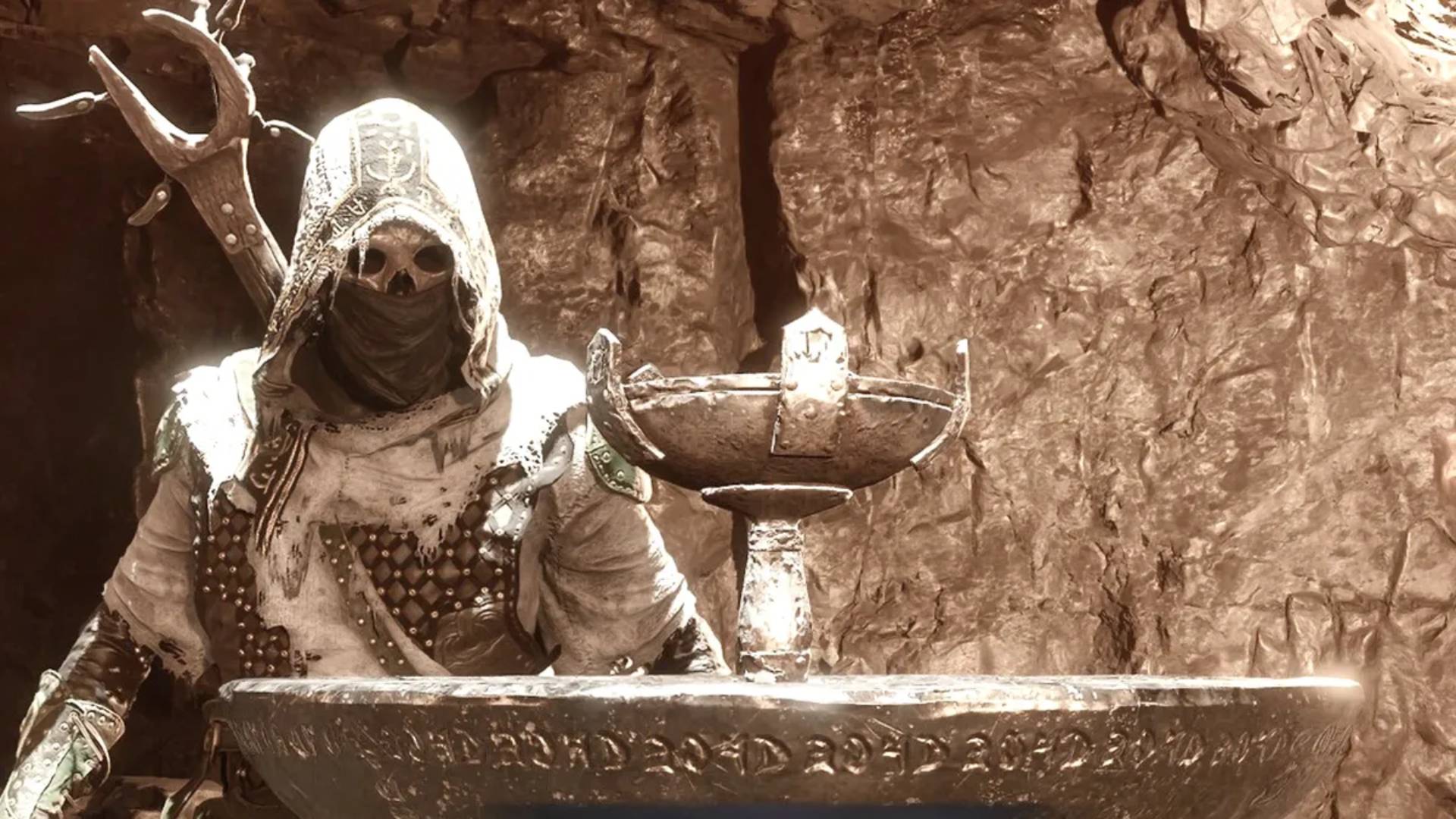 Mortal Shell 2 Figur neben dem Kelch zum Kommunizieren mit dem Chaos