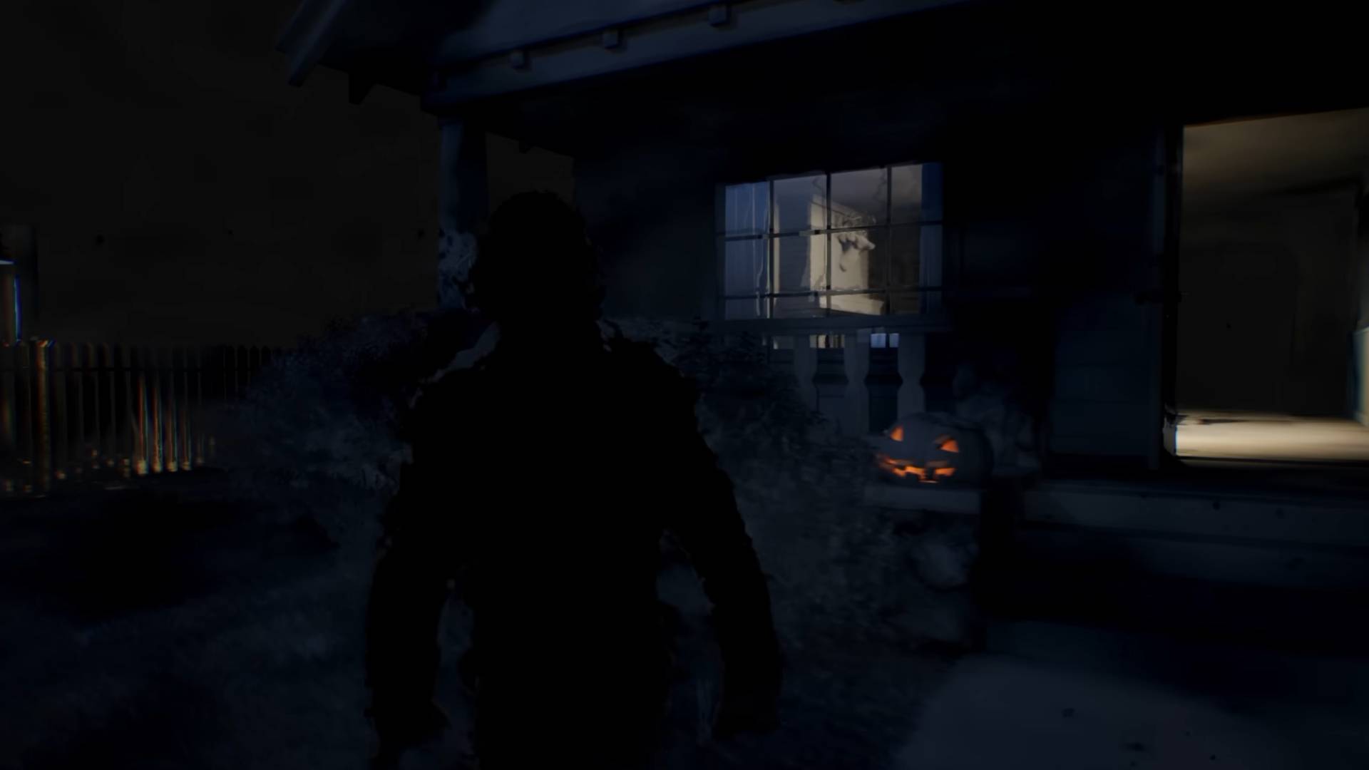 Halloween The Game Michael Myers vor beleuchtetem Haus in der Dunkelheit
