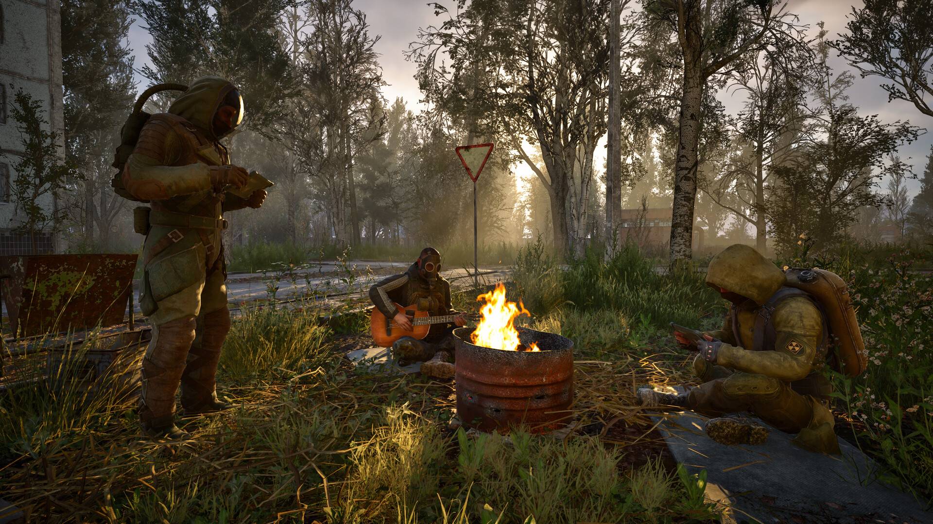 Stalker 2 drei Stalker sitzen und stehen an einem Lagerfeuer in der Zone