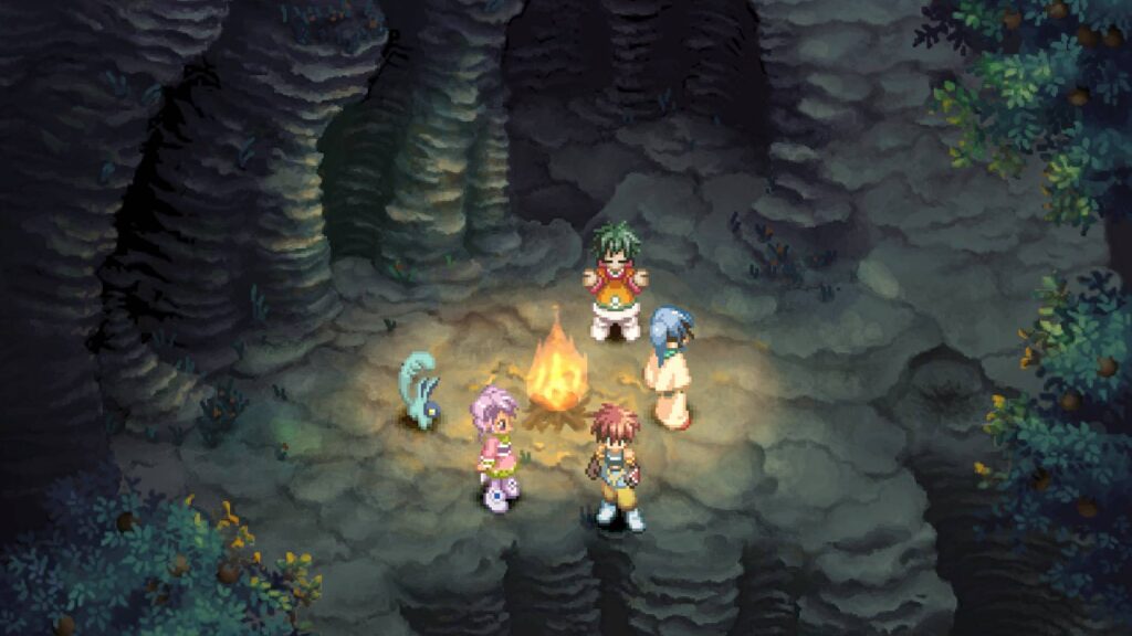Tales of Eternia Remastered: Reid und seine Gefährten versammeln sich um ein Lagerfeuer in einer felsigen Umgebung.